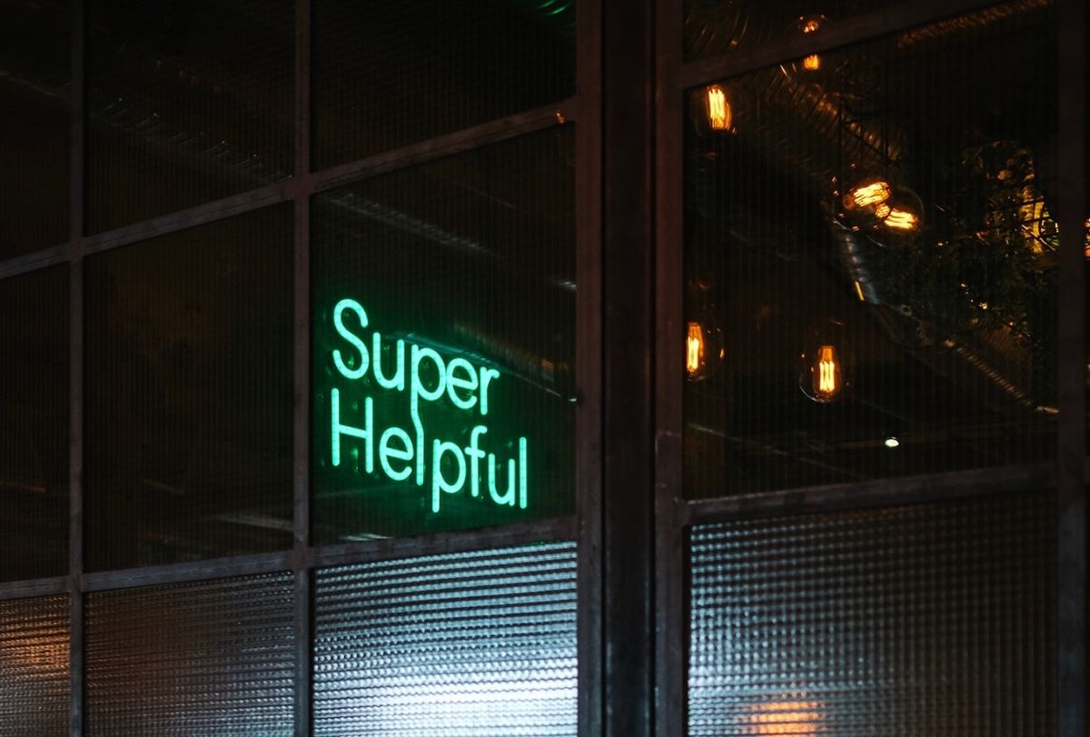 Neon sign reading Super Helpful